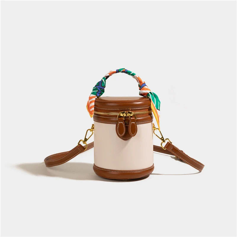 Dames bucket bag met sjaalhandvat en goudkleurige accenten