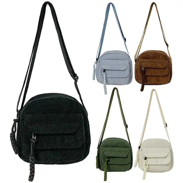Dames crossbodytas met gebogen klep en ritsvak