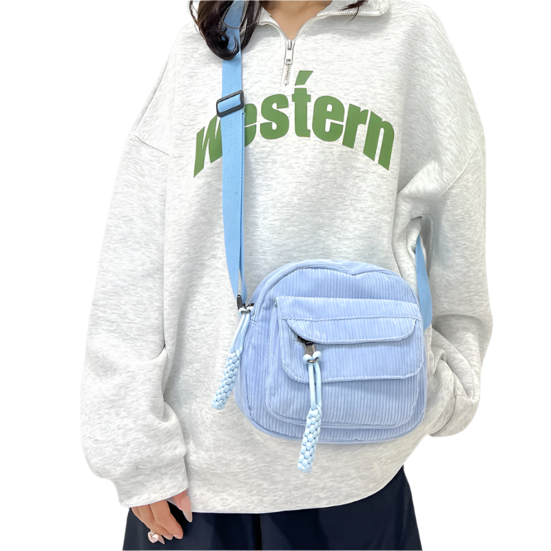 Dames crossbodytas met gebogen klep en ritsvak