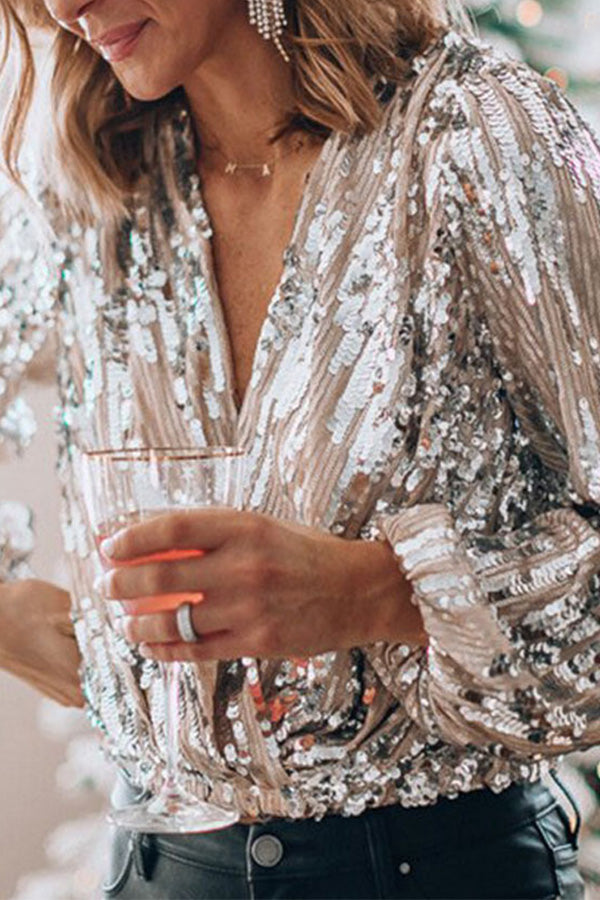 Dames paillettenblouse met lange mouwen en pofmanchetten