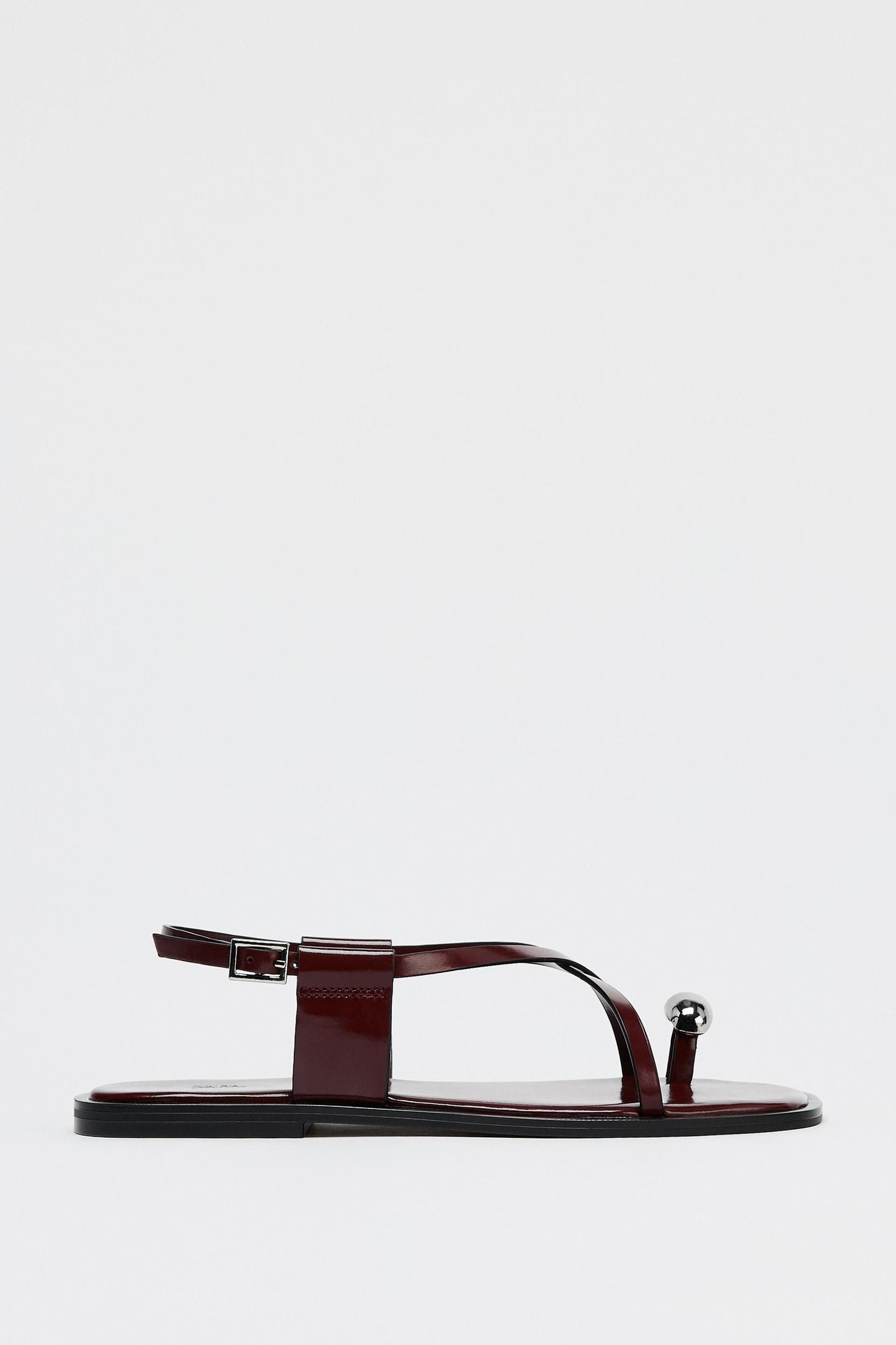 Dames platte sandalen met teenring en metallic detail