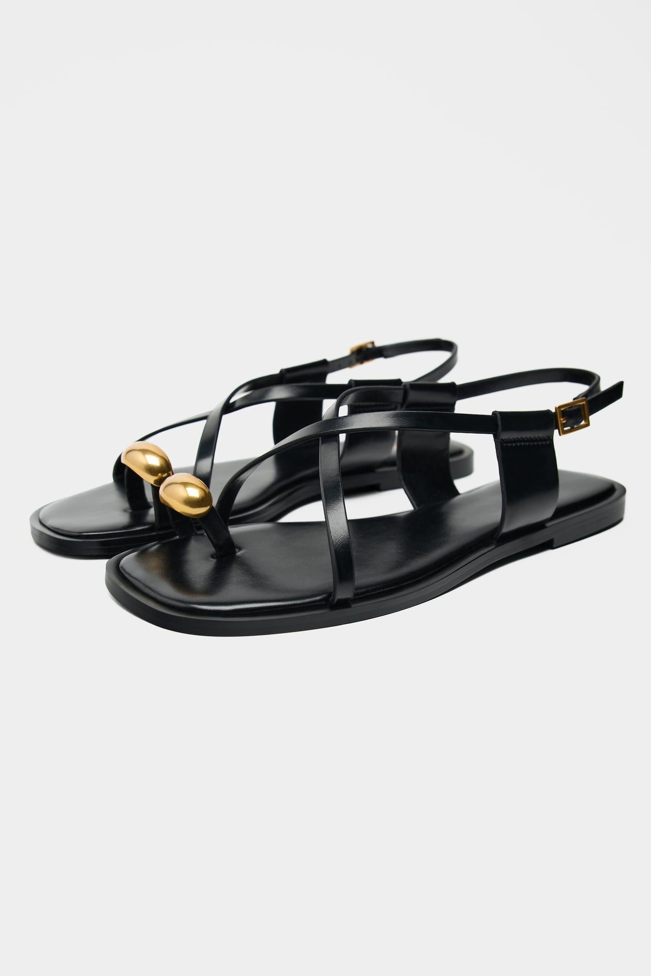 Dames platte sandalen met teenring en metallic detail