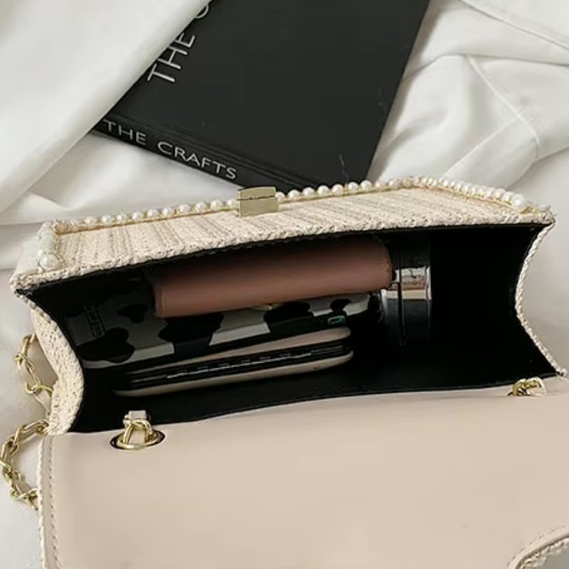 Dames schoudertas met gevlochten textuur en goudkleurige ketting