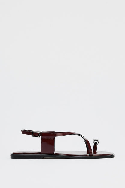 Dames platte sandalen met teenring en metallic detail