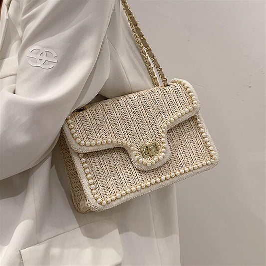 Dames schoudertas met gevlochten textuur en goudkleurige ketting